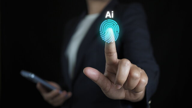 businesswoman touching a glowing digital fingerprint icon with AI text representing biometric security authentication and artificial intelligence identity verification technology - Powered by Adobe