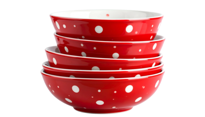 Stack of vibrant red ceramic bowls with white polka dots, isolated on a transparent background
