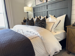 Contemporary bed with black wood headboard