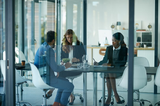 Business people, documents and discussion with team at office with review for case at corporate law firm. Group, lawyer and staff with planning, insight or collaboration for strategy at legal agency