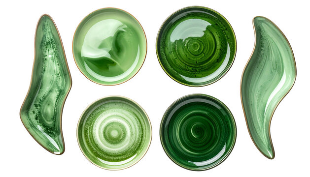 Six ceramic dishes of various greens and shapes, viewed from above, on black background