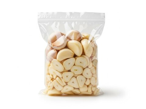 Peeled garlic cloves in a plastic bag isolated on white background