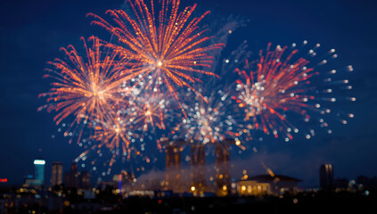 City skyline night fireworks display bursting with colorful light and festive energy