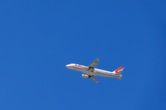 Passenger plane flying on a clear blue sky