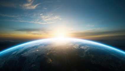 Fototapeta premium Sunrise over Earth horizon with glowing atmosphere and soft clouds, hopeful mood