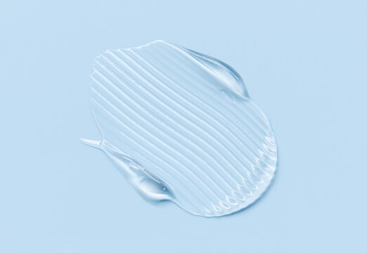 cosmetic texture gel essence smear on a blue background
