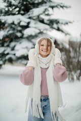 Young woman smiling enjoying winter cold weather