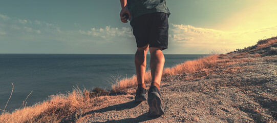 man walking on the beachside