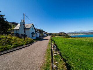 White Houses along a Rural Road in Scottish Highlands