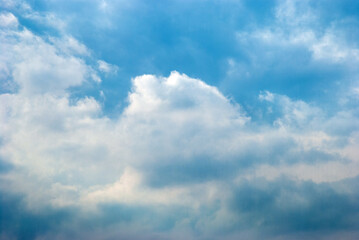 Fototapeta premium Fluffy White Cumulus Clouds on Bright Blue Sky Summer Day