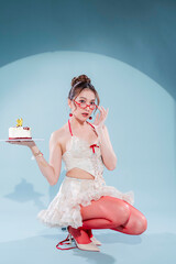 Elegant Asian beauty celebrates 30th birthday in white lace halter crop top and ruffled mini skirt with red ribbons, holding red velvet cake, wearing red heart glasses and cherry earrings, glamorous 
