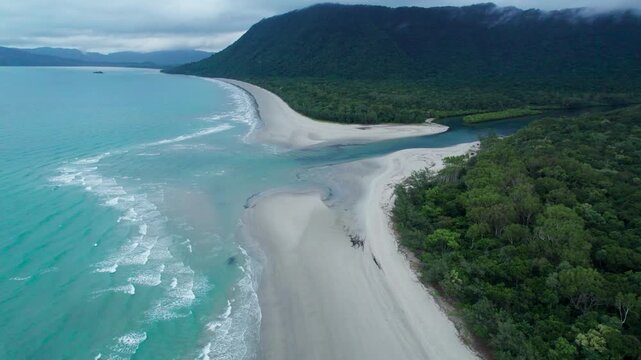 Aerial shot above Noah beach in the daintree rainforest near Cape Tribulation on an overcast day, north of cairn in Queensland, Australia