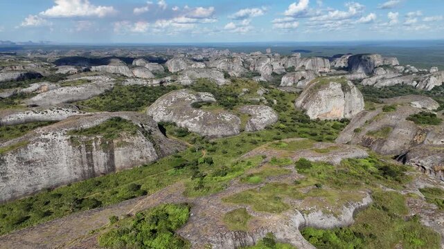 Cinematic drone flight over the vast field of Pedras Negras de Pungo Andongo monoliths in the Malanje Province, Angola, Africa, during a clear day