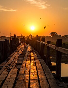 Golden Sunset Over the U Bein Bridge - A Serene Landscape of Myanmars Beauty.