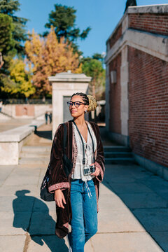 Tourist with camera exploring Madrid on a sunny day