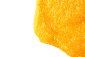 The texture of a orange body scrub with particles. Close-up