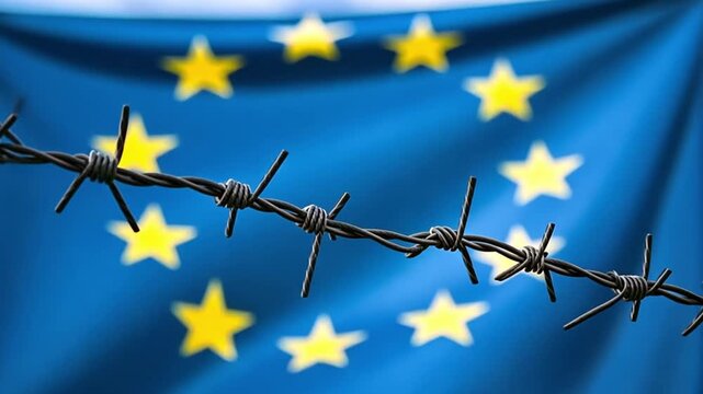 Barbed wire and European Union flag show tension and division of borders in Europe