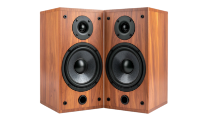 Two wooden audio speakers at a corner angle, displaying woofer, tweeter, and port