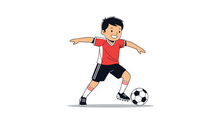 Obraz premium Young boy in a red and black soccer uniform dribbling a ball with focus and a happy smile on his face outdoors.