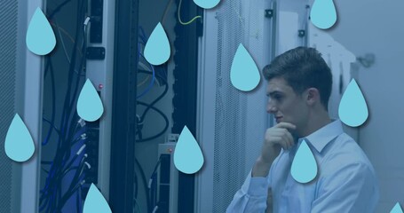 Animation of drop icons over caucasian male worker inspecting server room - Powered by Adobe