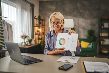 Mature senior woman work from home have consultation via video call
