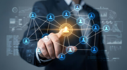 Professional hand interacting with a glowing digital network of interconnected user icons, symbolizing business connections, social media, and global communication