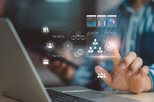 Business professional using AI interface on laptop for data management, user verification, workflow automation, digital analytics, and secure business decision support in modern enterprise technology. - Powered by Adobe