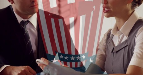 Animation of uncle sam hat icon against businessman and businesswoman discussing over smartphone