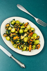 Mussels cooked with greens and brussels sprouts.