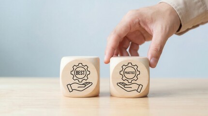 A hand places a wooden cube with the word practice on a light table next to a cube with the word best symbolizing successful business strategies and efficient processes