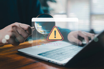 Cybersecurity expert inspecting source code on laptop with magnifying glass and warning alert symbol, representing software bug detection, system vulnerability, IT audit, risk management, security.