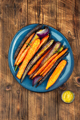 Vegetarian healthy food, baked carrots.