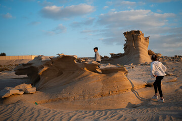 Children exploring fossil dunes in abu dhabi desert © Zoran Jesic