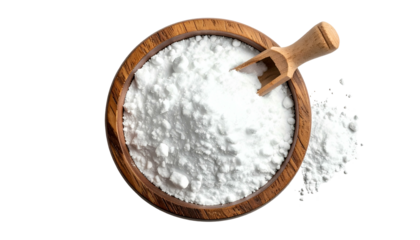 Top-down shot of white powder in a wooden bowl with scoop, contrasted by black backdrop