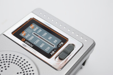 Portable battery-powered AM/FM radio photographed against a white background.