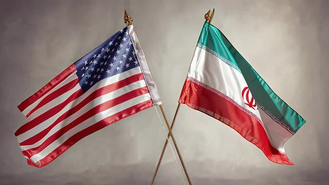 Iranian and American flags stand crossed together