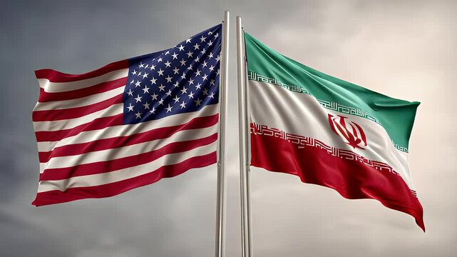 Iranian and American flags wave side by side under the sky