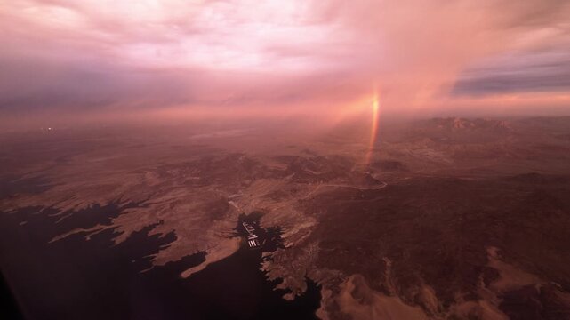 Early Morning Nevada Desert and Colorado River aerial view. Beautiful red desert from the view of an airplane almost looks like Mars.