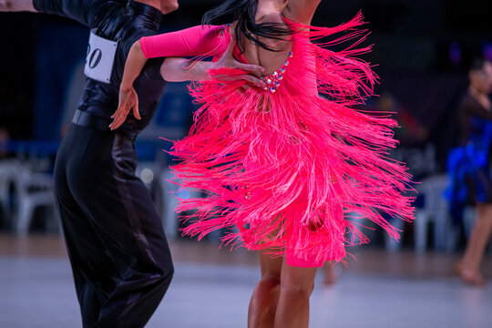 Close-up ballroom dance couple performing latin dance