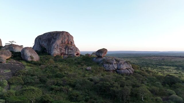 prehistoric geological site of Pedras Negras de Pungo Andongo, Malanje, Angola, Southern Africa, through this high-angle cinematic drone perspective during golden hours