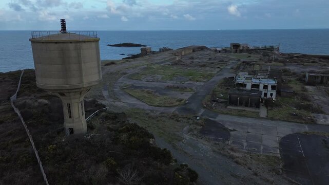 Disused Octel chemical facility aerial view abandoned coastal industrial factory and water tower