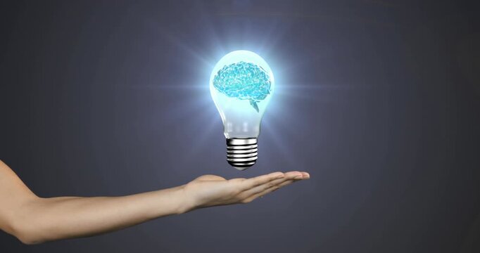 Animation of human brain spinning inside a electric bulb over cupped hand against grey background