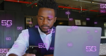 Animation of 5g text and data processing over african american businessman using laptop - Powered by Adobe