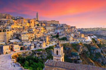Fototapeta premium The Sassi of Matera. Panorama of the old town from San Pietro Caveoso church at sunrise. Apulia, Italy.