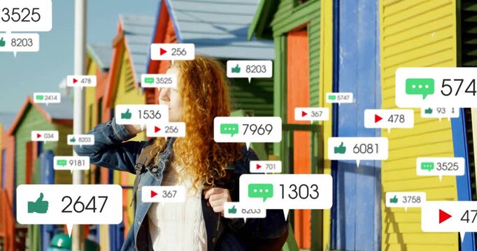 Surrounded by social media notification icons, woman with curly hair using animation