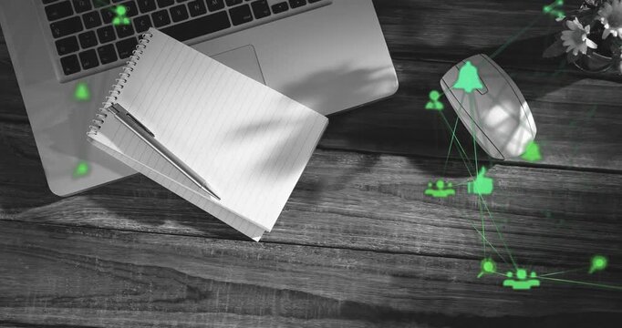 Translucent green icons arising on desk migrating toward mouse forming network showing engagement