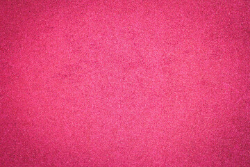 Vivid red glitter texture background with shimmering metallic sparks. Luxury glowing sequin surface for festive Christmas celebration, Valentine's Day, wedding backdrop, or creative glamour design.