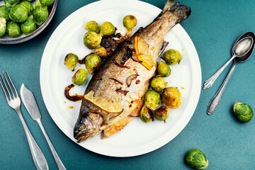 Whole trout fish baked in an oven.