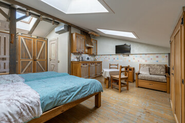 Bright rustic attic studio with open plan living area