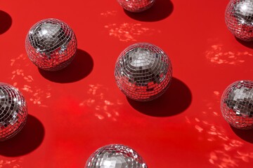 Shiny Disco Balls on Red Background